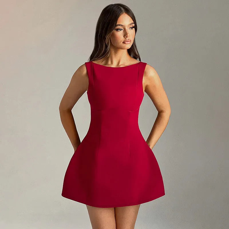 Slim-fitting backless sleeveless short dress in a sling style on a hanger.