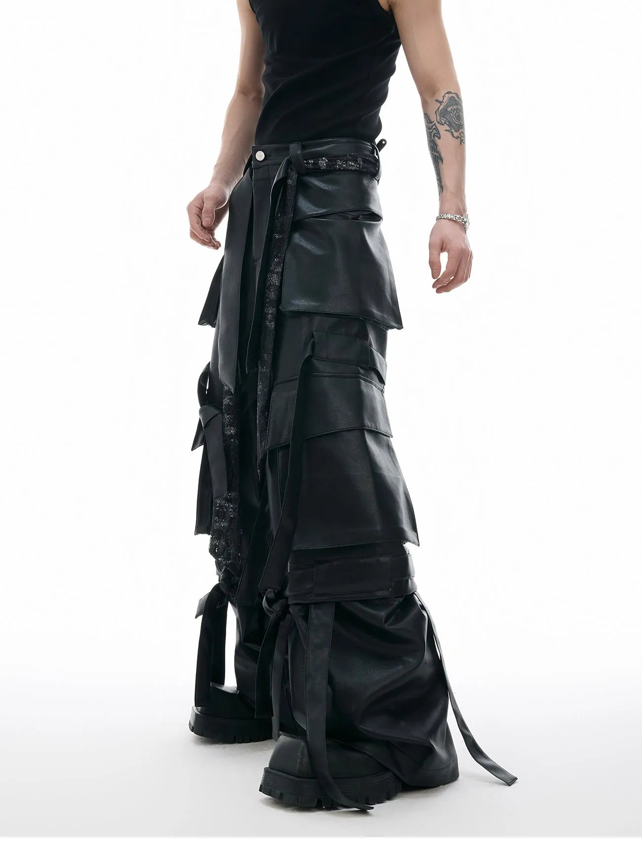 Black quilted leather pants with multiple pockets and loose-fit retro streetwear design