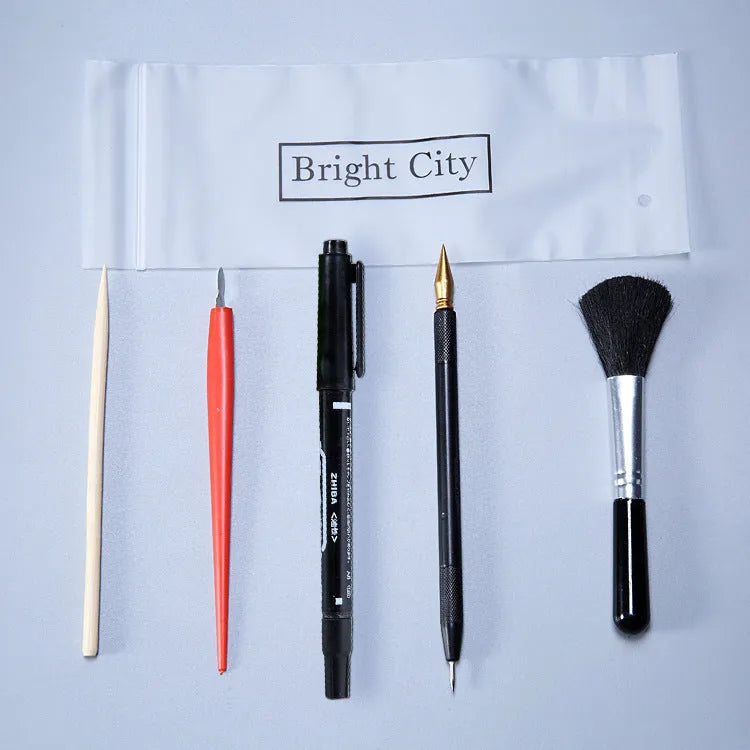 Scraping painting tool set with scratch pens, small scrapers, and white card paper for texture art
