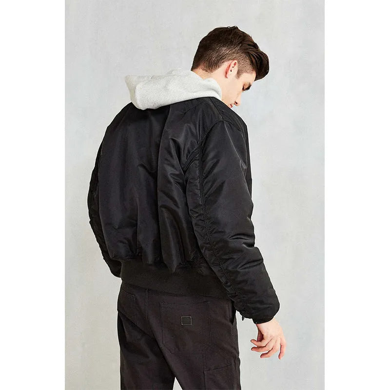 Men's army green loose fit cotton-padded bomber jacket with front zip and ribbed cuffs.