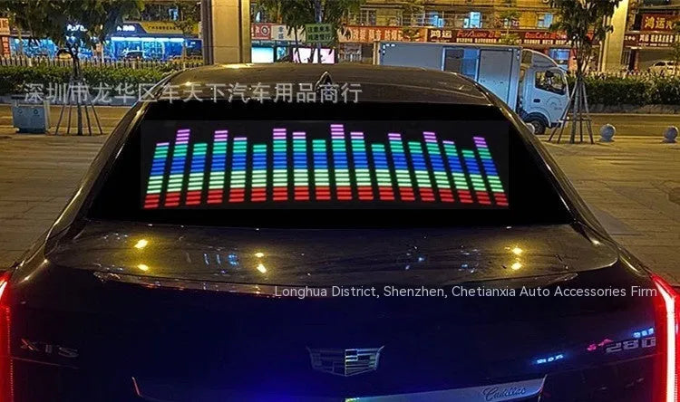 Car interior voice-controlled rhythm light displaying one of its 16 electroluminescent patterns on a 90 by 25 cm panel.