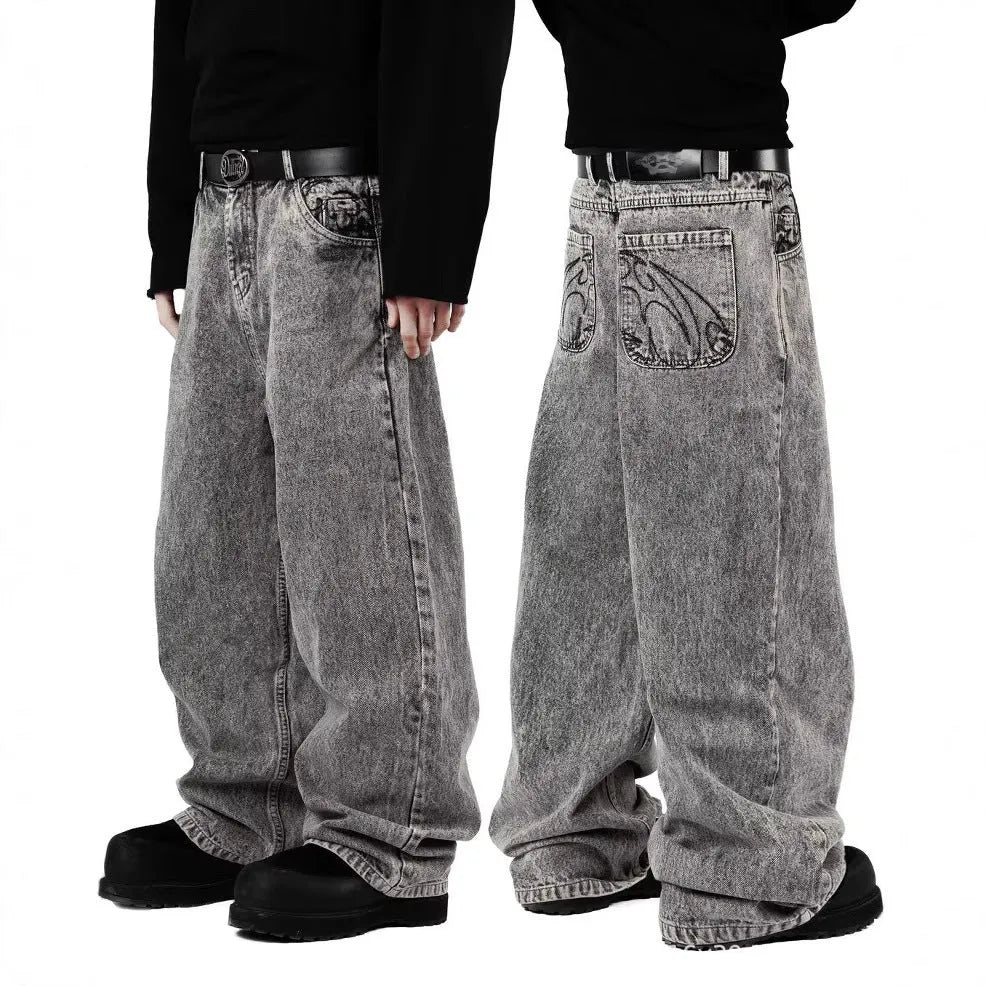Grey loose fit straight-leg denim trousers with mid-waist design on a hanger