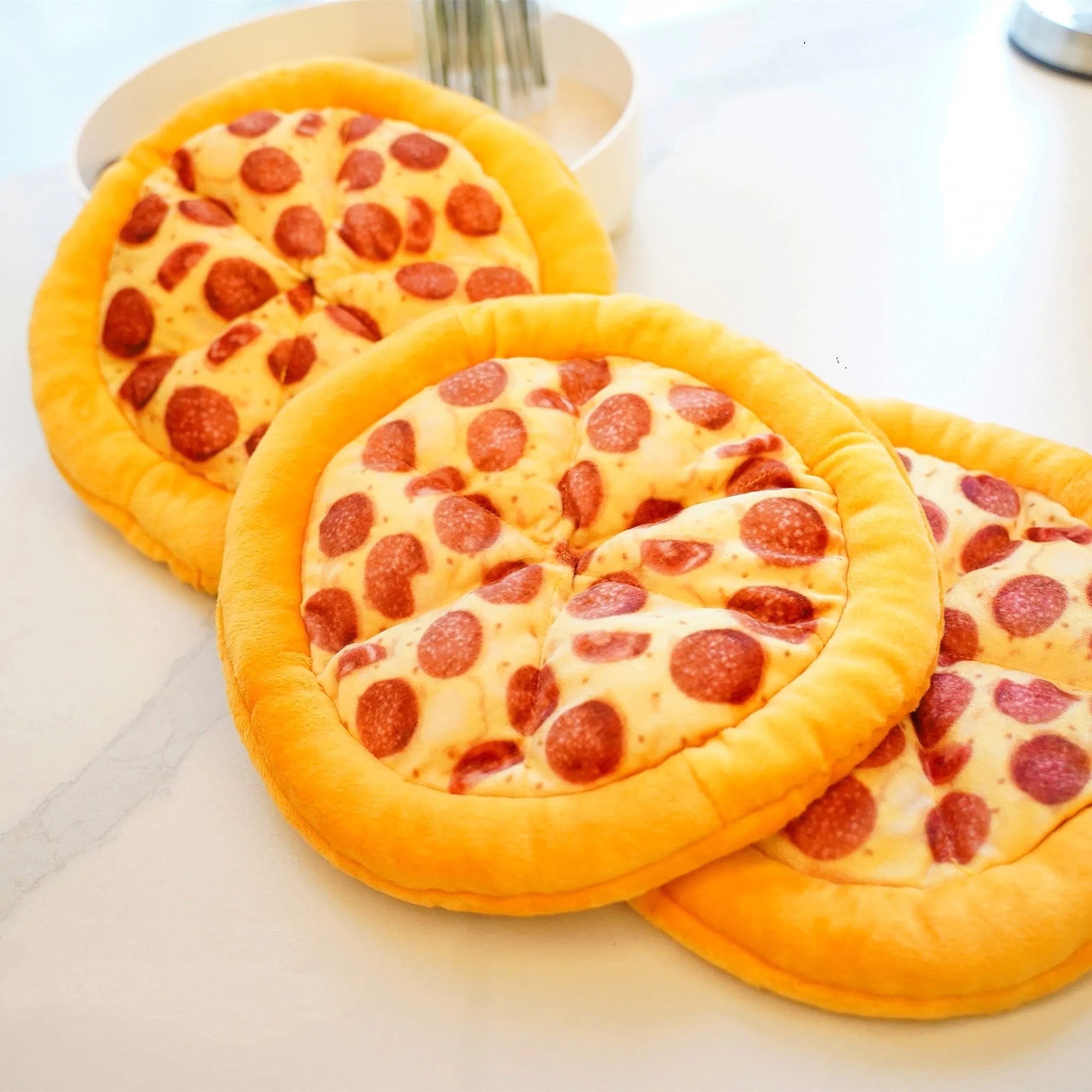 Yellow pizza slice dog chewing toy with squeaker made from teddy fabric