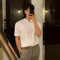 Men's black thin slim-fit short-sleeved knitted pullover shirt on a hanger.