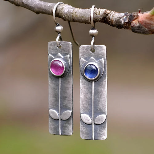 Antique finish red sapphire earrings with geometric ellipse shapes and electroplated metal construction
