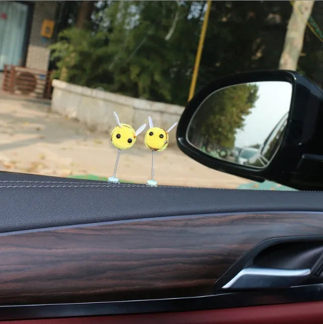 Cartoon bee car decoration ornament with furry ball material measuring 3x3cm