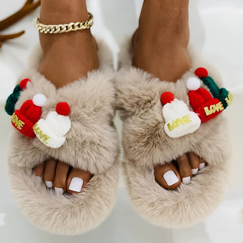 Adult Christmas hat decoration slippers in faux plush with rubber sole.