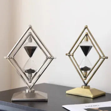 Glass sand timer ornament with zinc alloy metal base showing sand flow timing mechanism