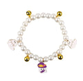Close-up of a simulated pearl cat collar with a detailed Halloween pumpkin charm, showing the purple ghost design variant.