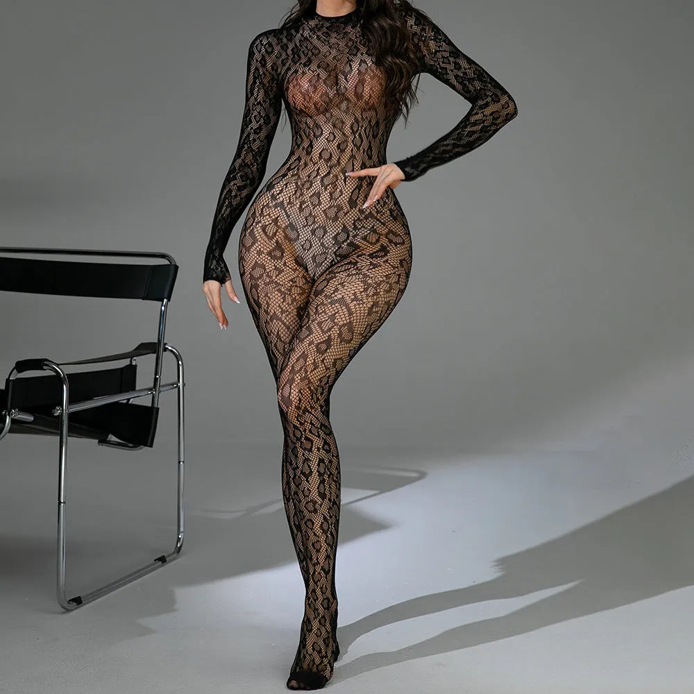 Women's black long sleeve backless lingerie one-piece in jacquard fishnet fabric on a mannequin.