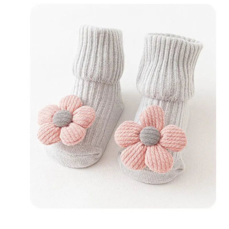 Cotton baby floor socks in various patterns including animal prints, stars, and bows for infants aged 0-3 months
