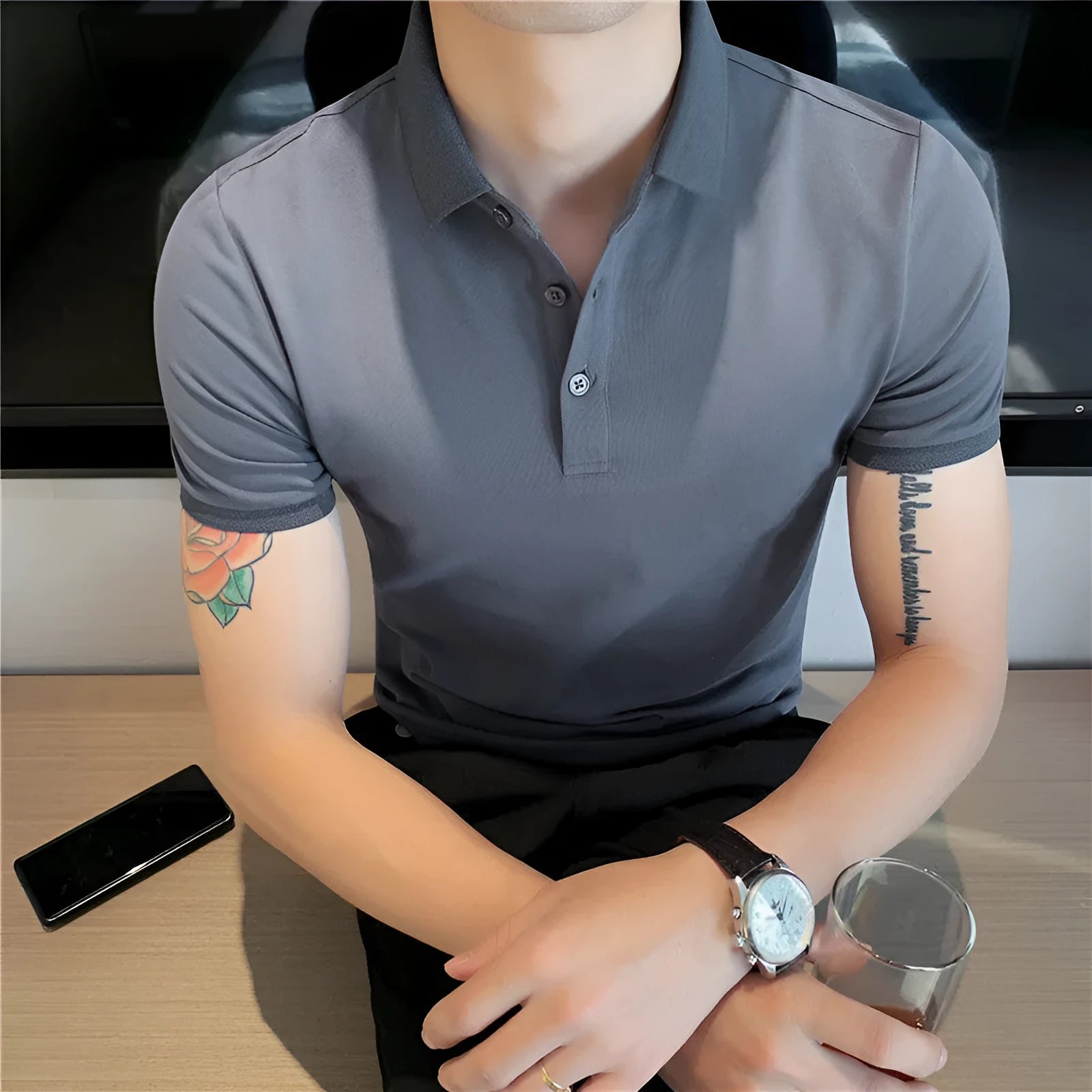 Slim-fit solid colour polo shirt with lapel collar and short sleeves on a hanger.