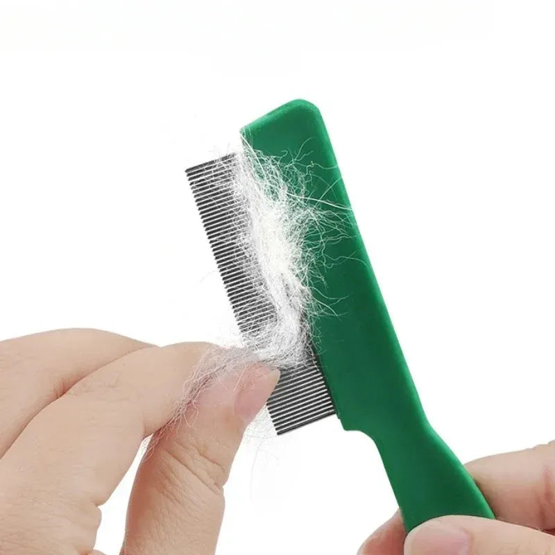 Green plastic handle stainless steel pet flea comb for dogs and cats on a white background.