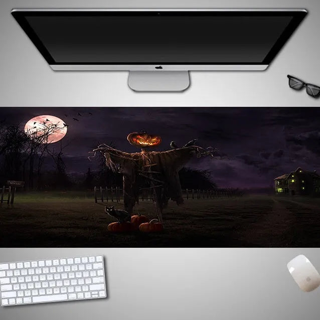Oversized Halloween-themed computer mouse pad with non-slip rubber cloth base on a desk