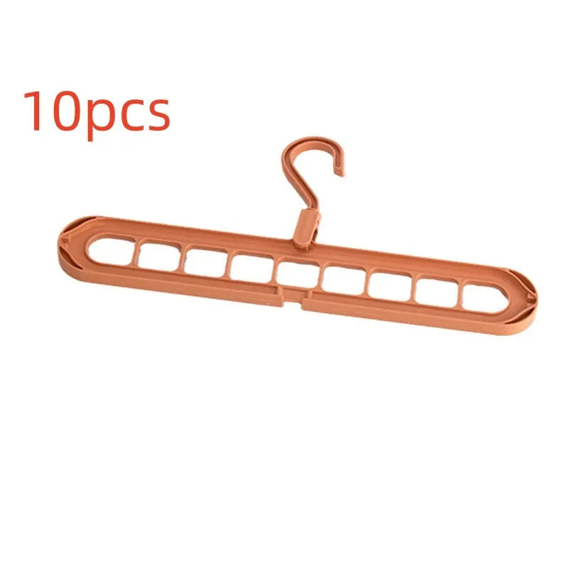 Green plastic nine-hole folding hanger for trousers displayed open and closed.