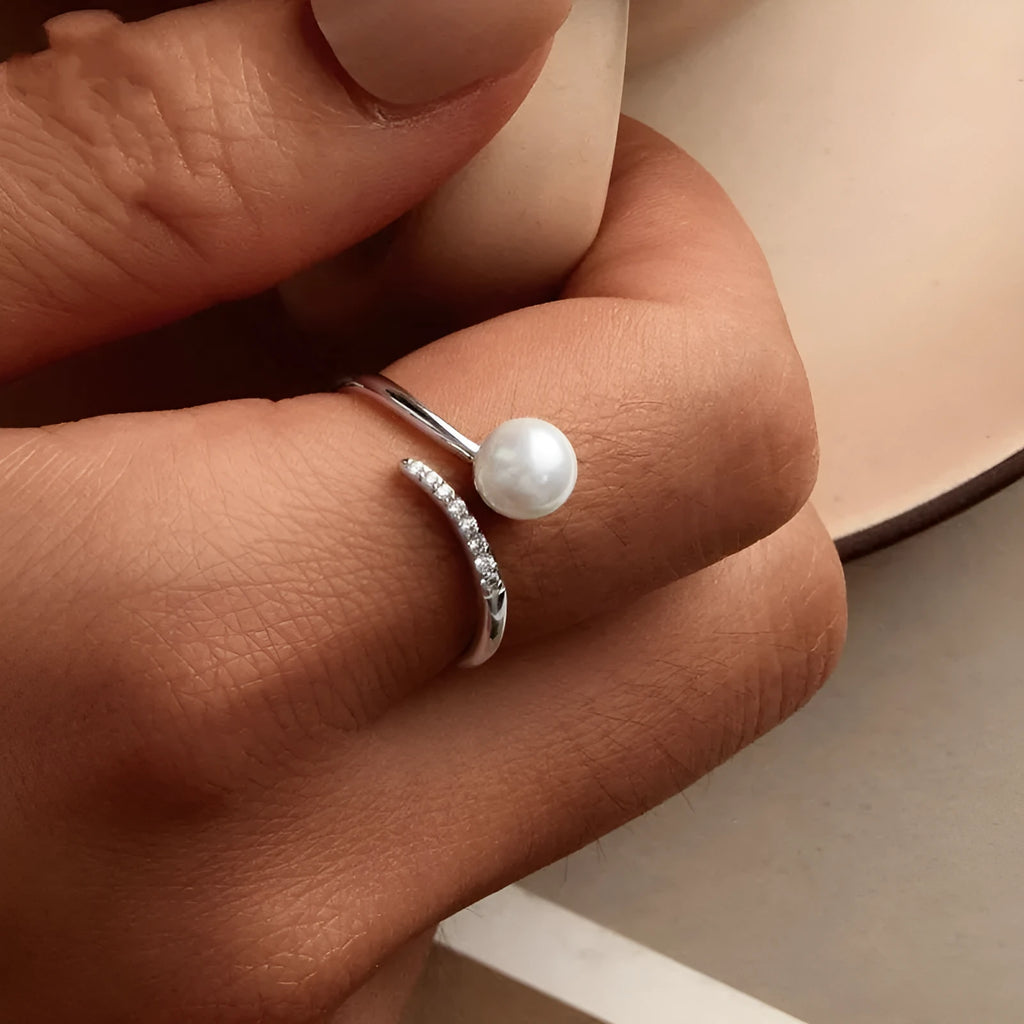 Sterling silver adjustable pearl ring with natural shell pearls on open loop design