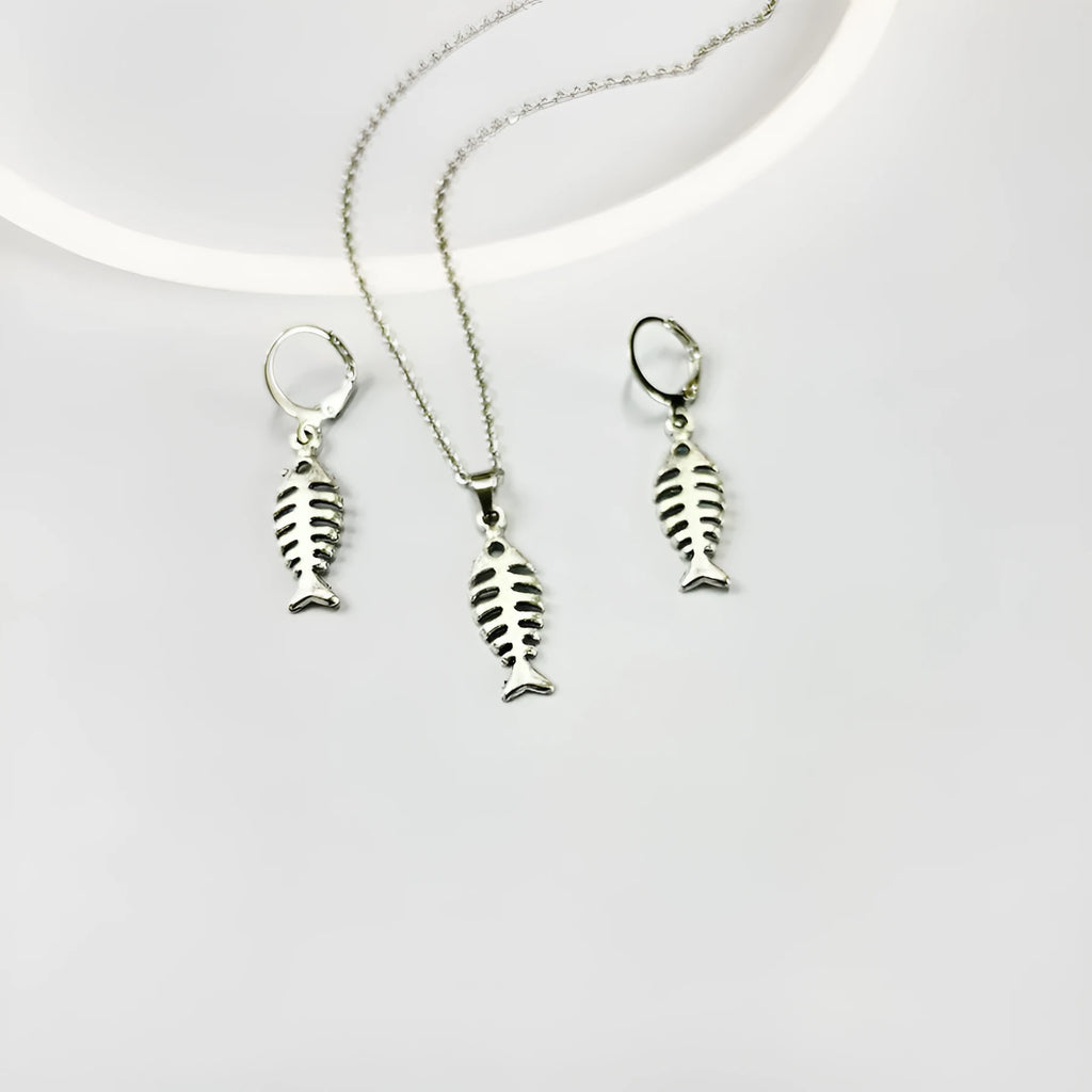 Fishbone pendant necklace and earrings set with adjustable chain on white background
