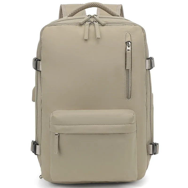 Large grey lightweight Oxford cloth travel backpack with curved shoulder straps shown from the side.