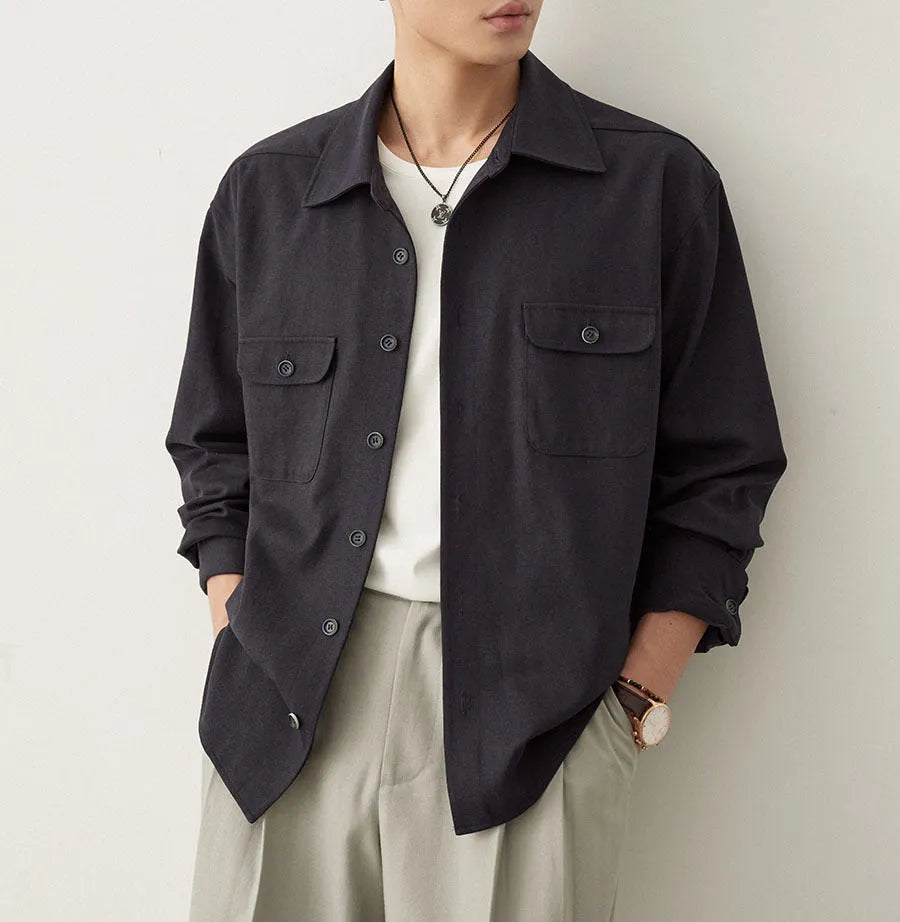 Men's light sand rice colour casual long sleeve shirt with a simple lapel, on a hanger.