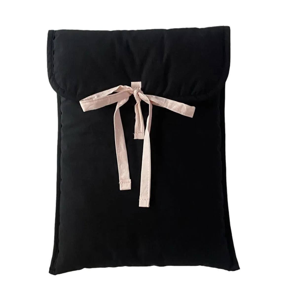 Women's black quilted laptop bag with ballet-style bow detail and striped pattern design