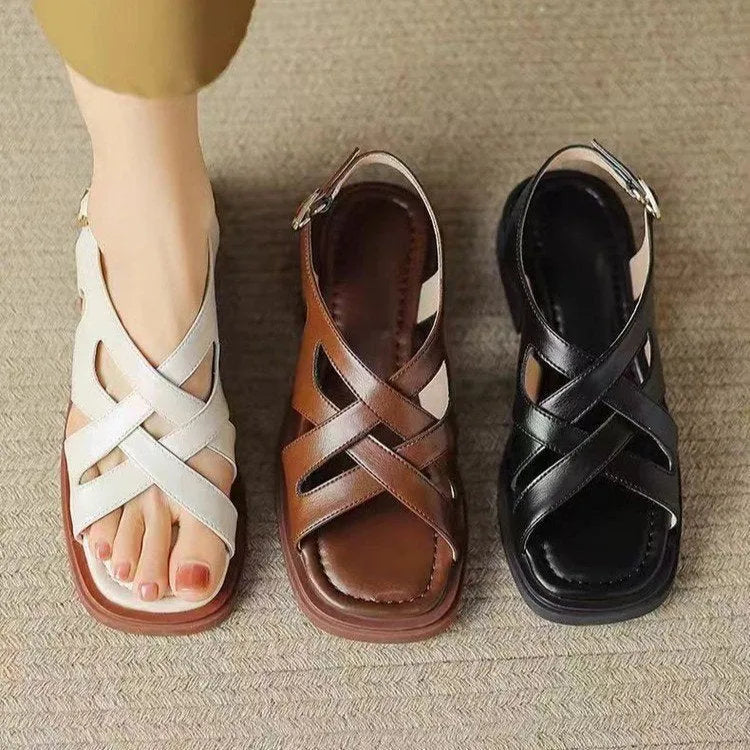 Women's patent leather square toe sandals with cross straps in black colour