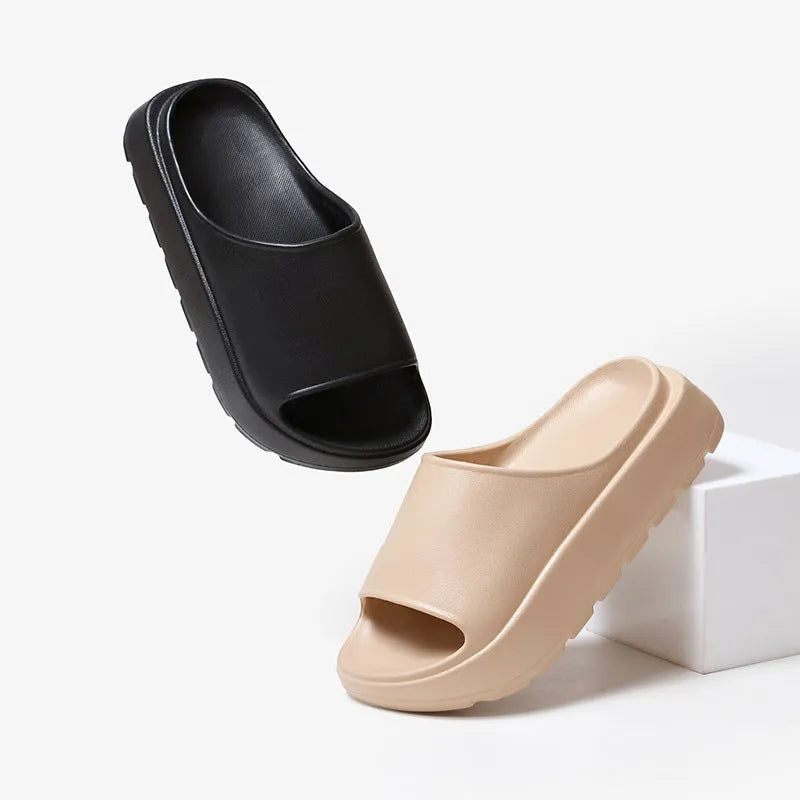 Women's beige thick-soled slippers with fish mouth pattern on 5.5cm EVA sole.
