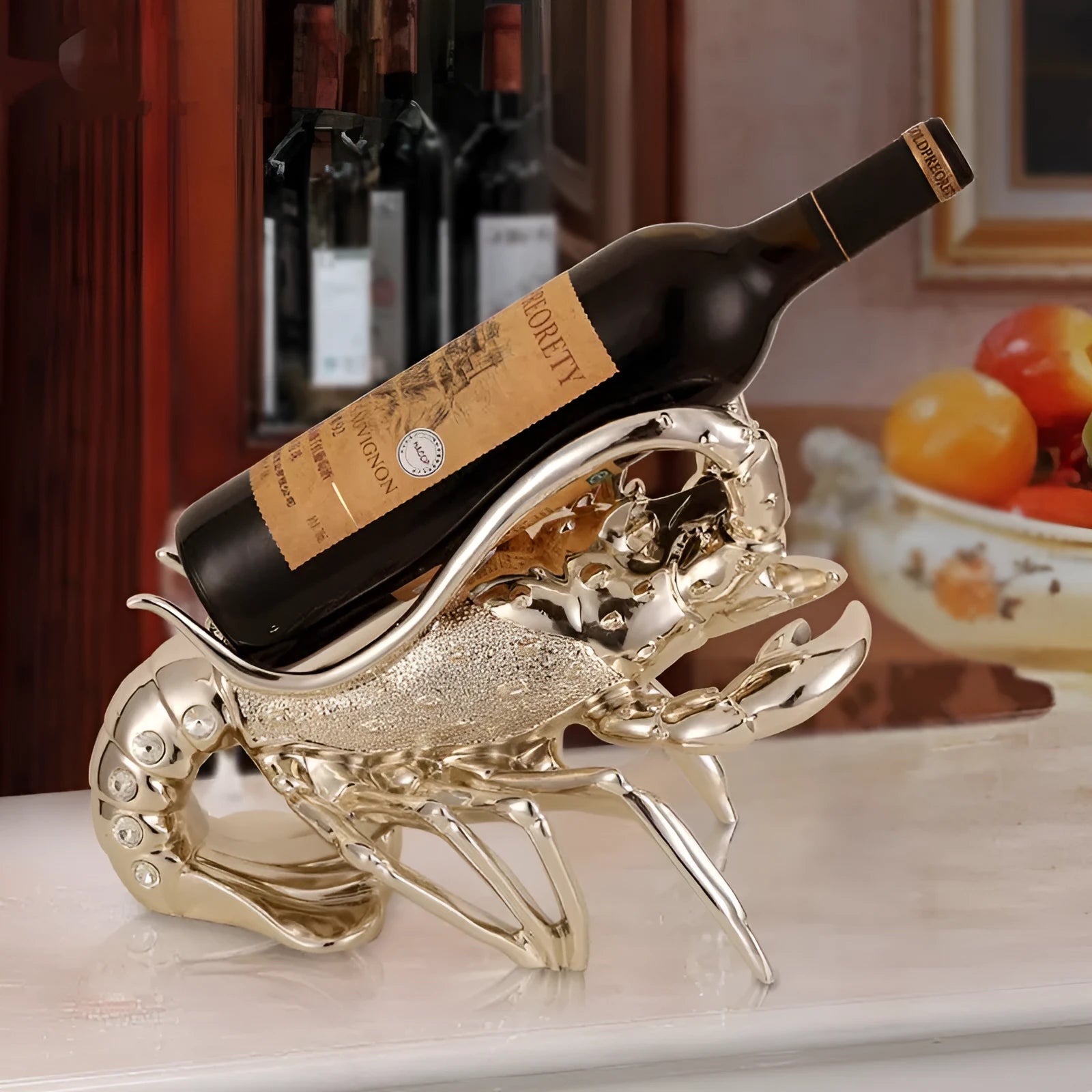 Lobster-shaped decorative wine rack ornament in metallic rose gold holding a wine bottle.