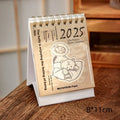 Mini A5 desk calendar 2025 showing one of eight themed designs in simple modern style