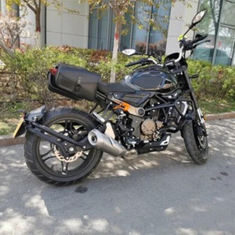 Black motorcycle swingarm saddlebag mounted on Harley-Davidson Sportster side