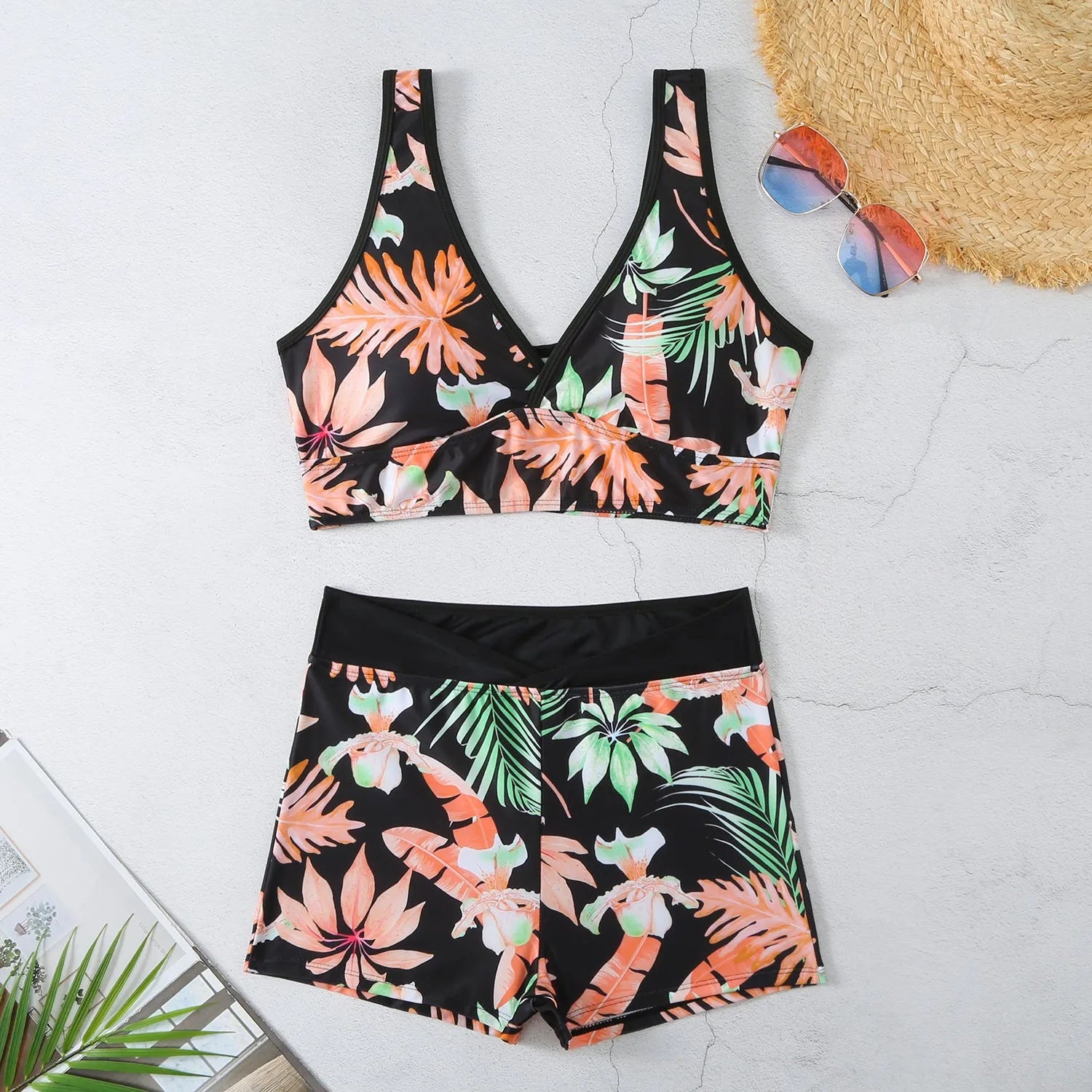 Women's two-piece sleeveless swimsuit with boxer shorts in a multi-colour print.