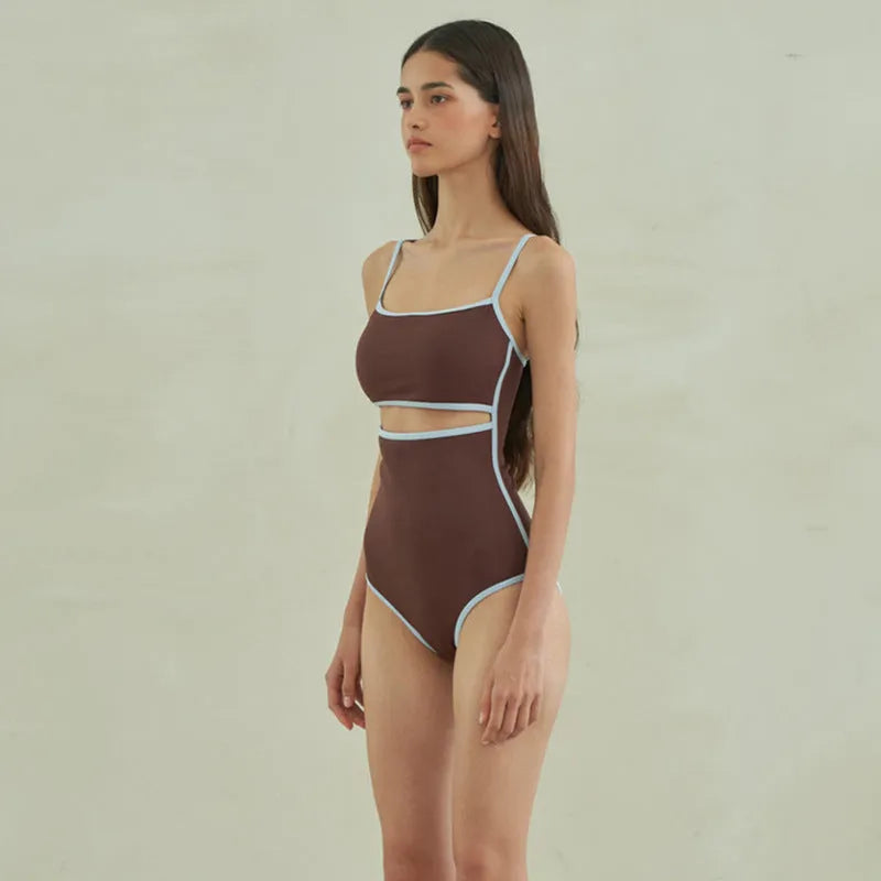 Brown nylon one-piece triangle swimsuit for women laid flat.
