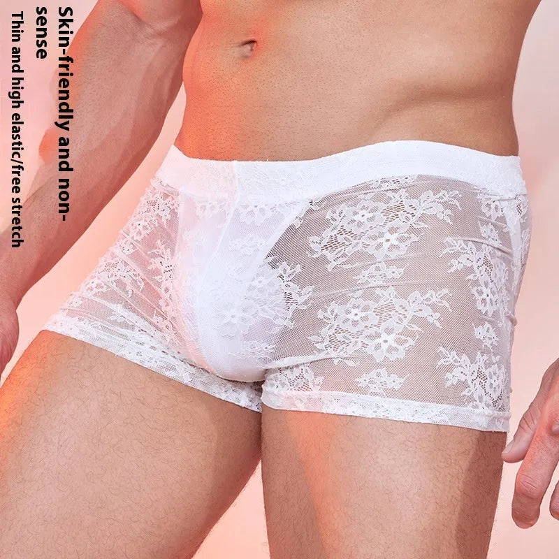 A pair of men's nylon lace boxers on a neutral background, shown in the available black, white, and red colour options.