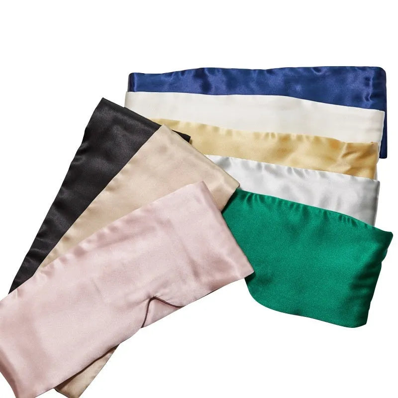 Mulberry silk sleep eye mask shown in multiple colours including black, champagne gold, and navy blue.