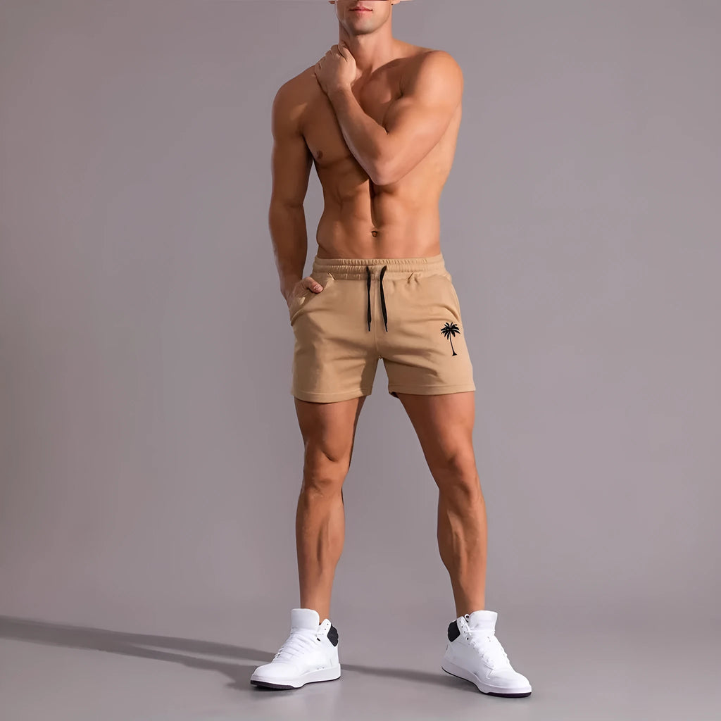 Men's khaki coconut print sports shorts with elastic waistband and straight leg cut