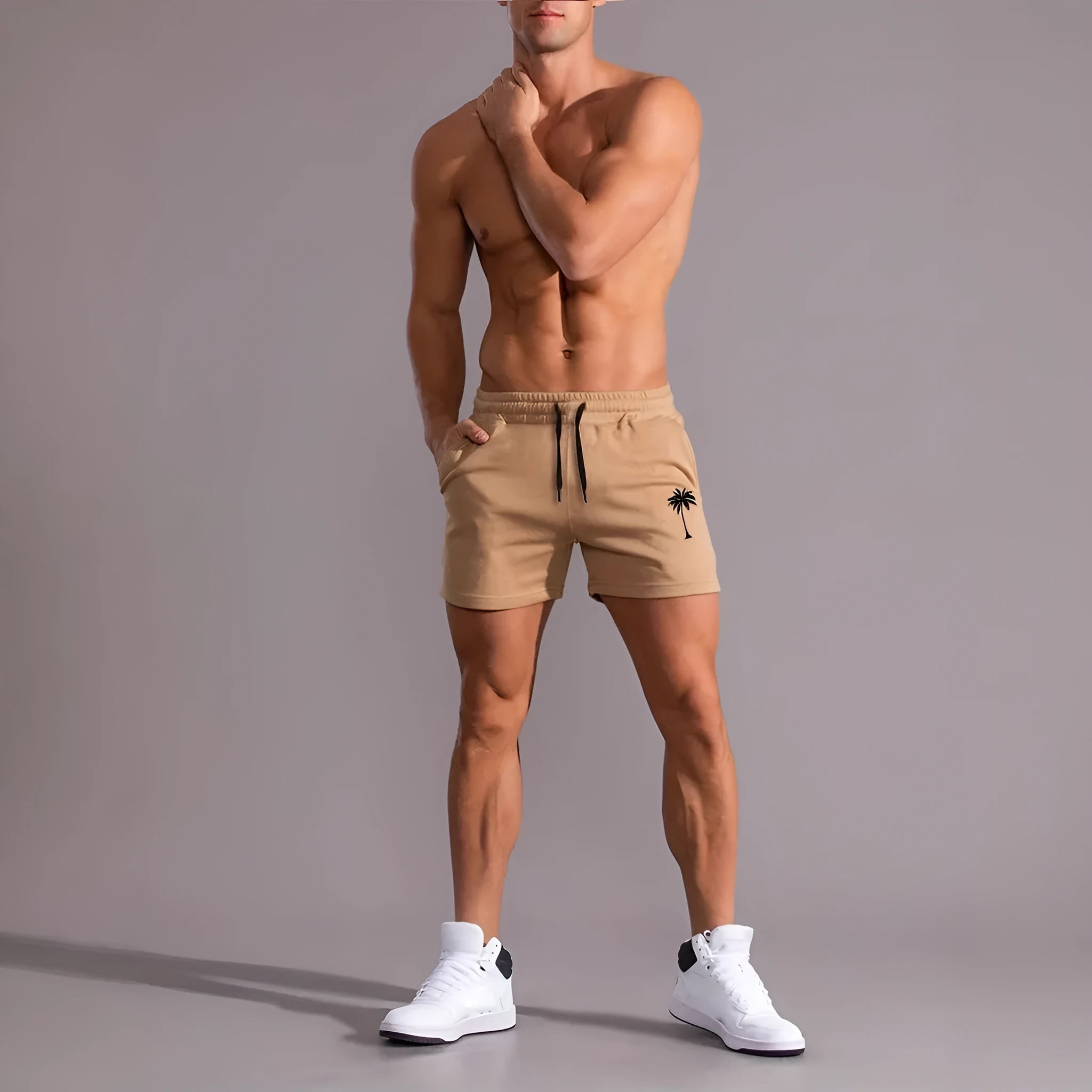 Men's khaki coconut print sports shorts with elastic waistband and straight leg cut