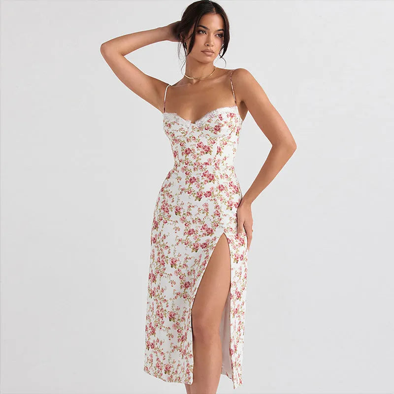 Blue lace flowers print long dress with spaghetti straps and a high leg slit on a mannequin.