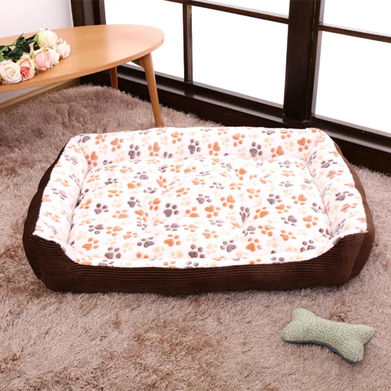 Soft beige plush dog bed with raised sides in a sofa-style design for small pets.