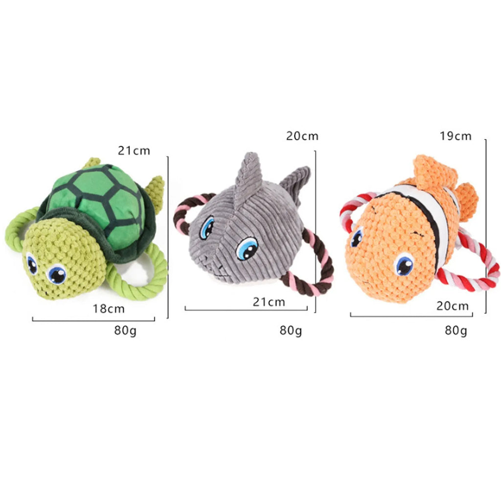 Grey, green, and orange turtle-shaped plush dog chew toy with knotted texture