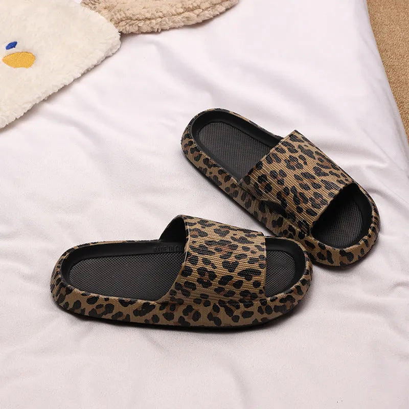 Women's leopard print EVA slippers with a thick sole on a plain background.