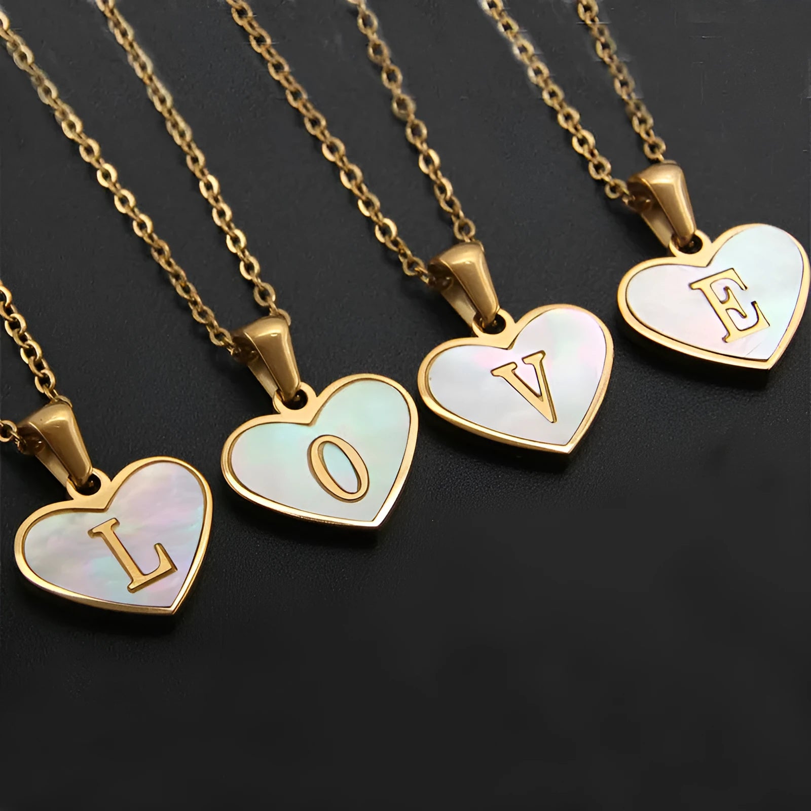 Gold plated heart-shaped white shell pendant personalised initial necklace on a stainless steel chain.