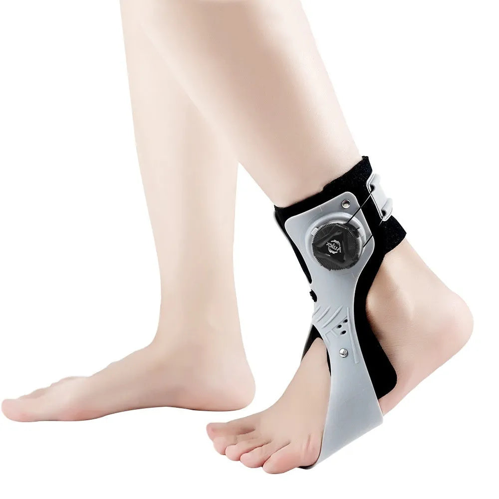 Grey and black airbag button ankle support brace shown on left and right foot