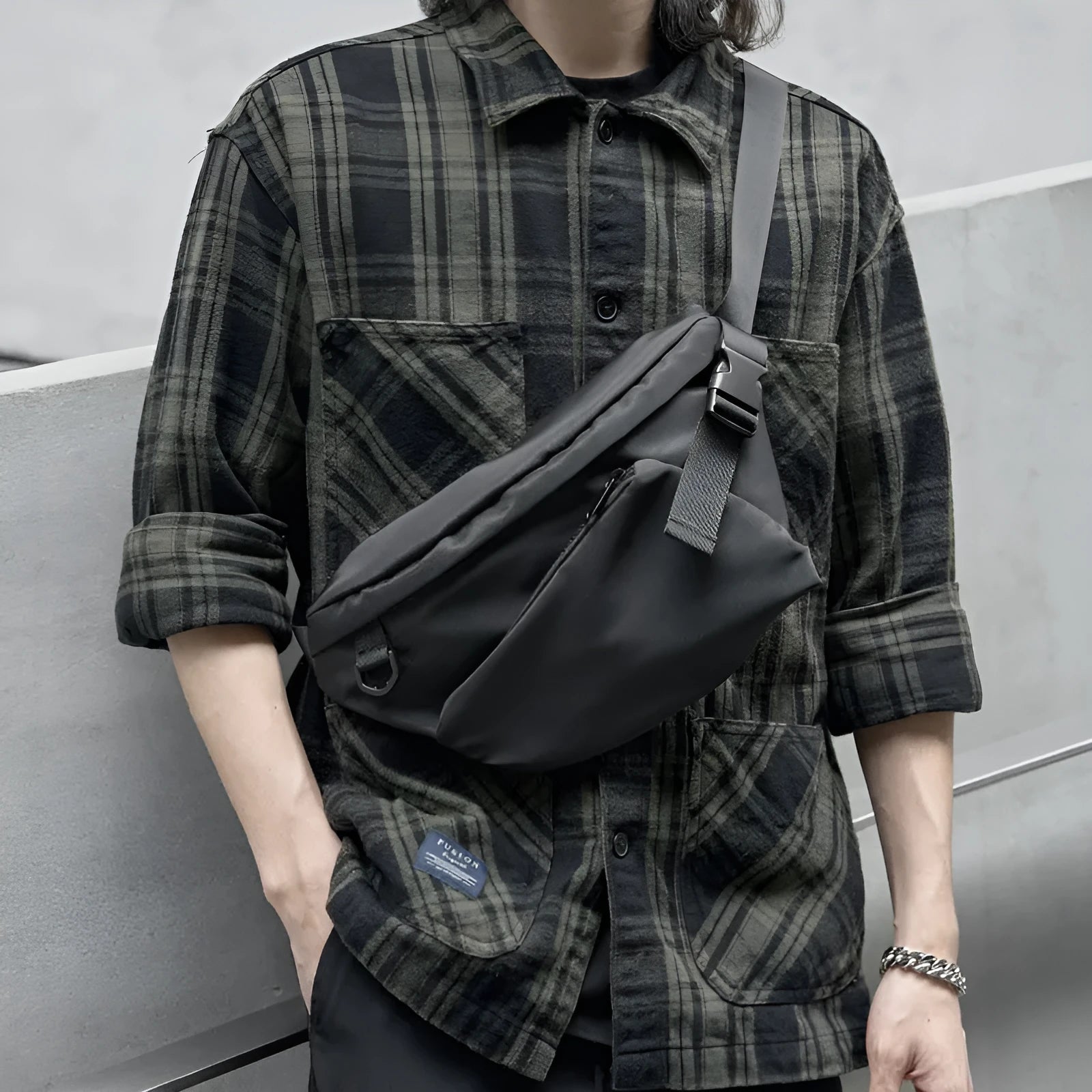 Black slanted chest bag made from Oxford fabric with sewing line details