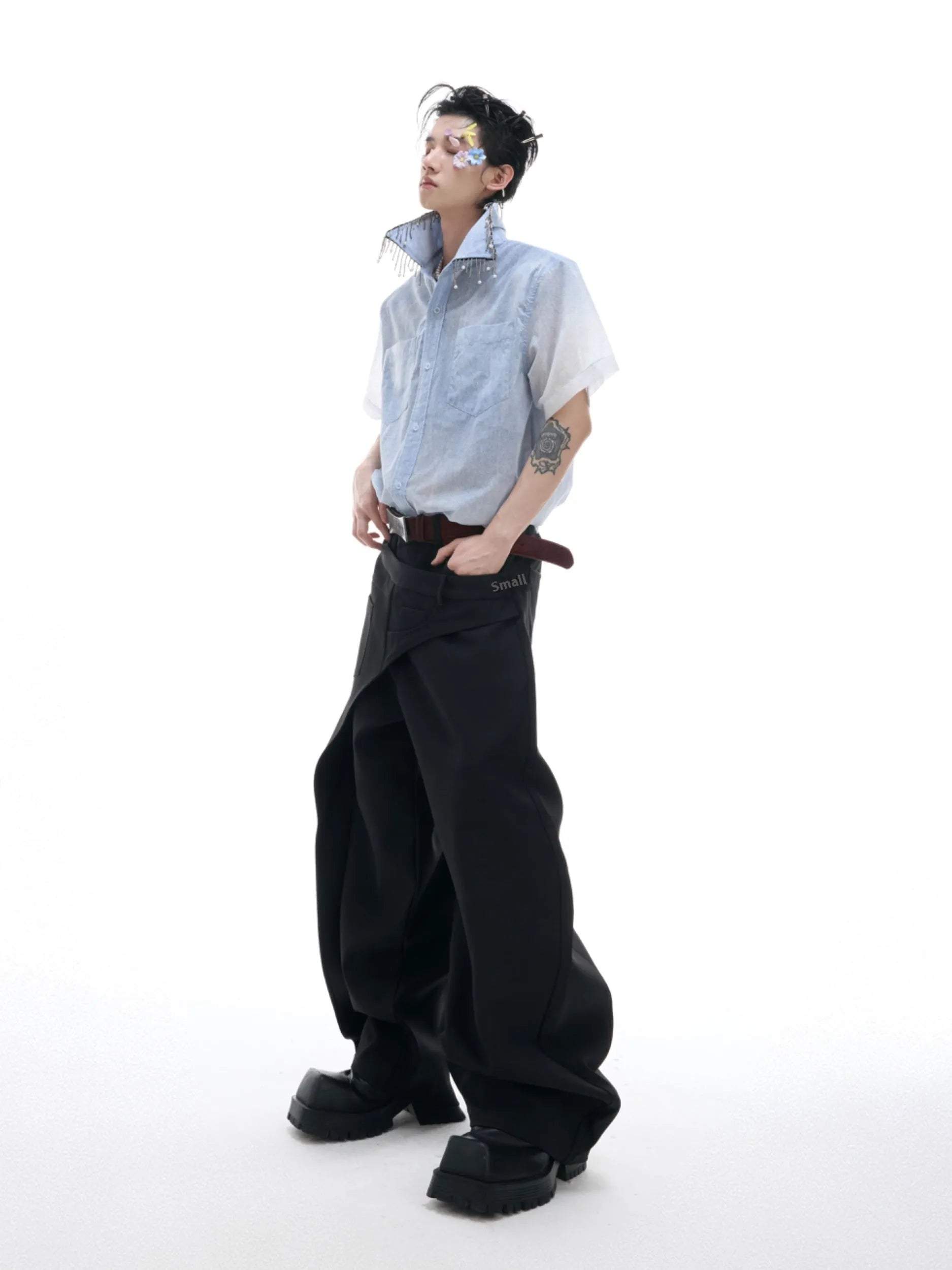 Men's solid blue loose fit short sleeve casual shirt on a hanger.