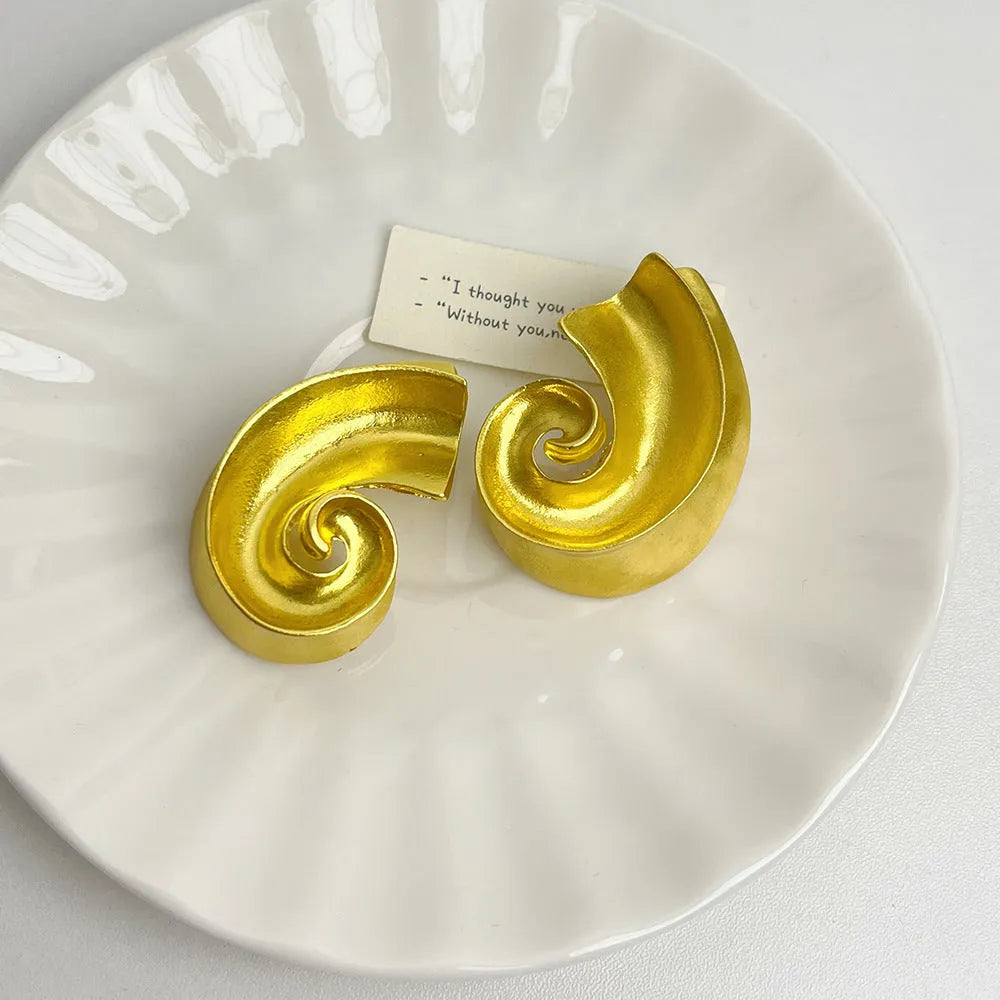Retro geometric ear studs in gold and silver colours with 5cm size and electroplated finish