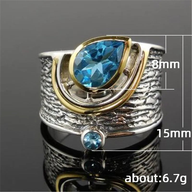 Blue drop-shaped zircon ring with rhinestone inlay on an alloy band, shown in women's sizes 6 to 10.