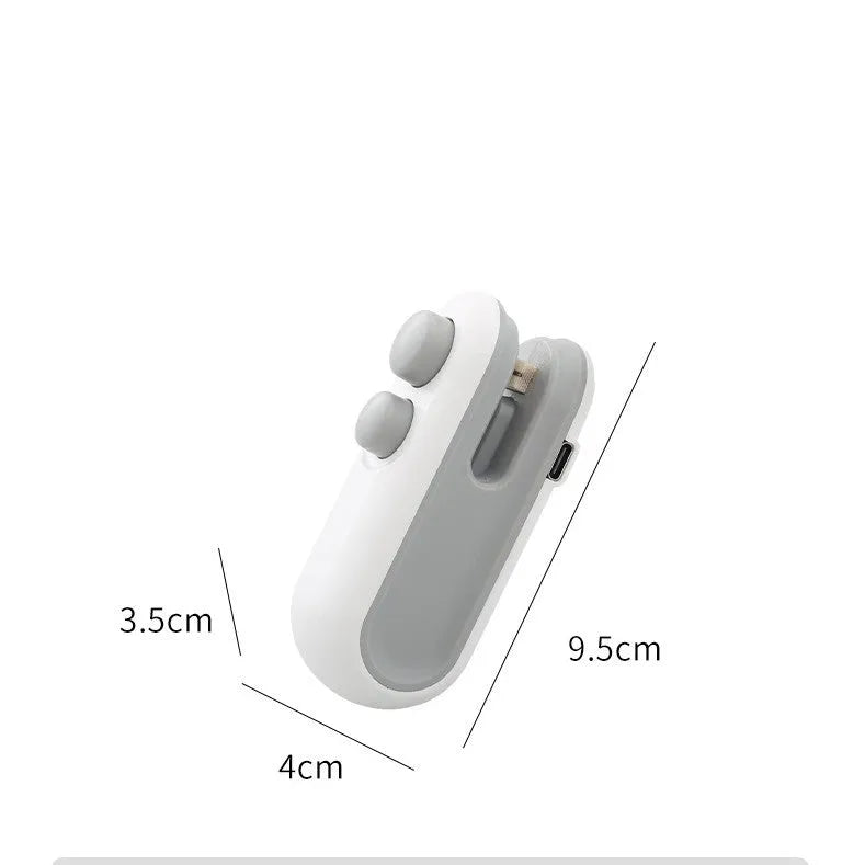 White and blue handheld USB rechargeable heat sealer with cutter blade.