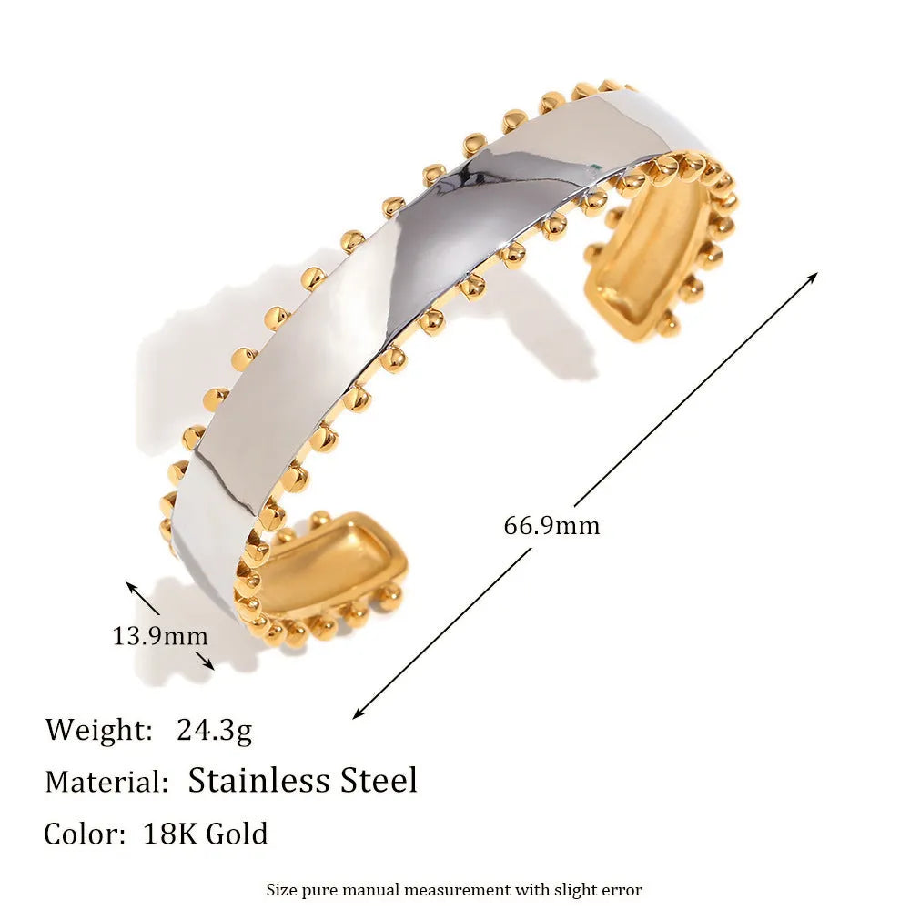 Gold tone geometric jewellery set including earrings, bracelet and necklace with round ring design elements
