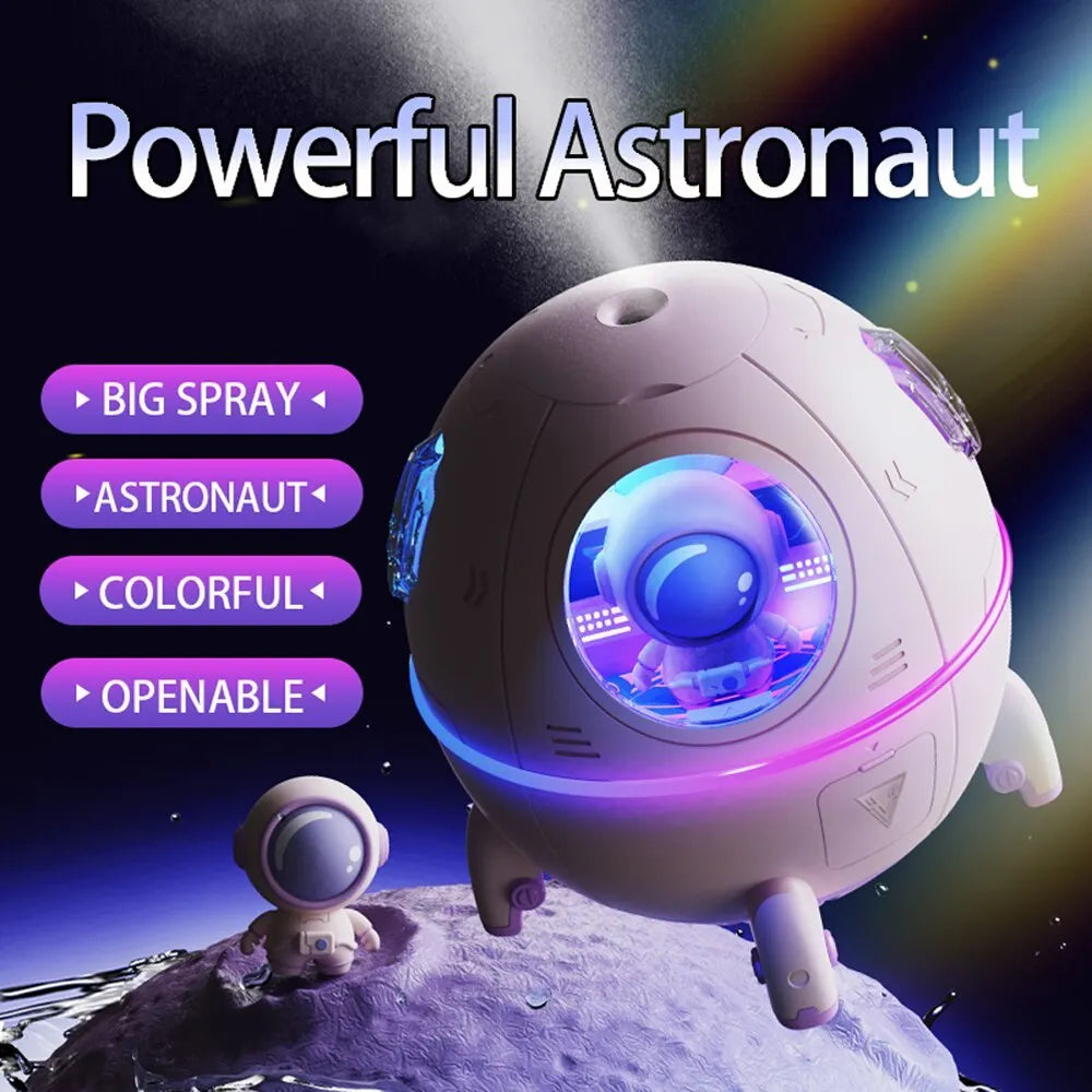Purple astronaut-shaped USB desktop humidifier with colourful LED light on a desk
