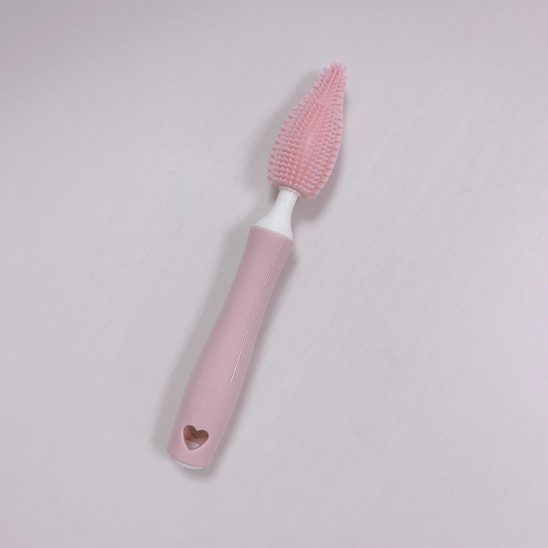 Silicone baby bottle brush and straw cleaning tool set in assorted colours.
