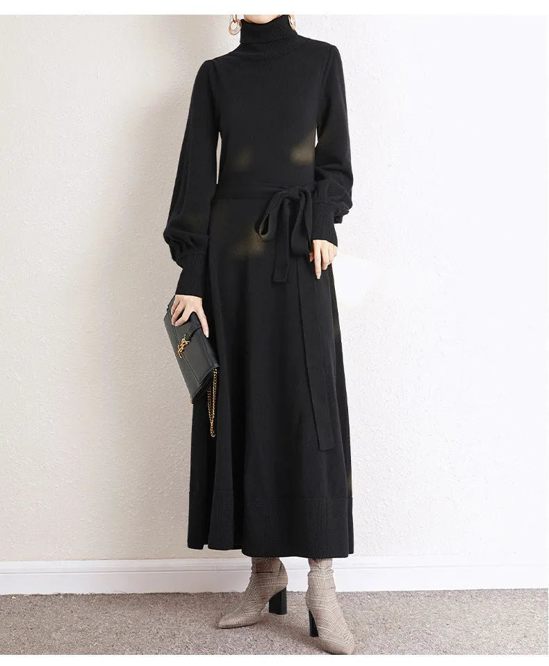 Women's knitted turtleneck dress with long sleeves, elastic waist, and a loose A-line skirt in a solid colour.